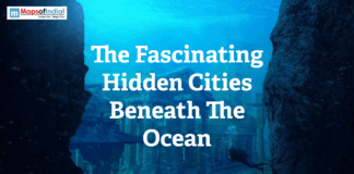 The Fascinating Hidden Cities Beneath The Ocean Illustration of an ancient hidden underwater city beneath the ocean with ruins, deep blue water, and a diver exploring submerged structures.