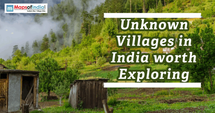 Scenic view of a peaceful village in the Indian hills with forests, greenery, and misty surroundings.
