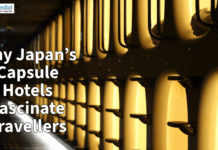 Why Japan’s Capsule Hotels Fascinate Travellers Rows of illuminated capsule hotel pods in Japan, highlighting the compact and futuristic accommodation style popular among travelers.