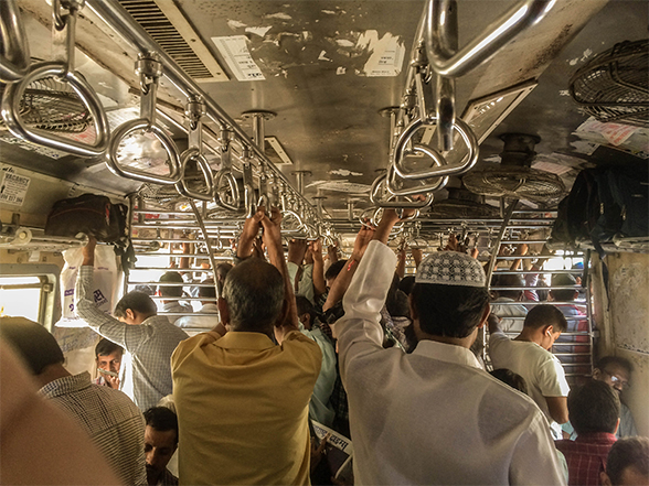 People standing 2nd class cabins in local trains of mumbai