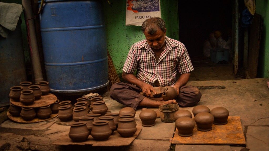 Potter mending pots