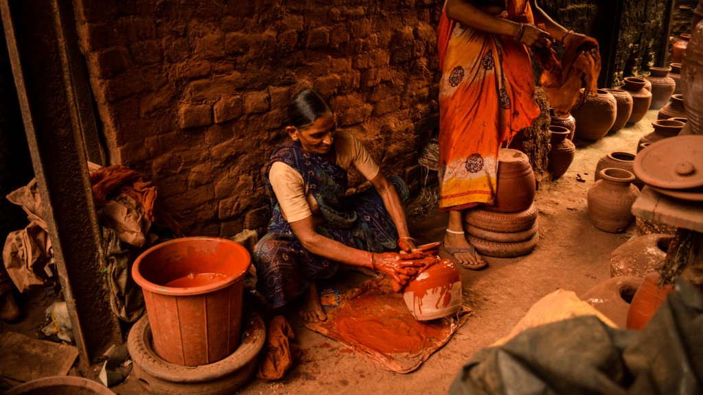 Potter painting pots