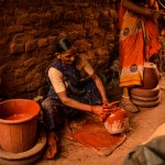 Potter painting pots