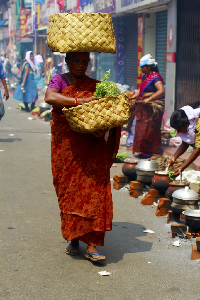 Woman selling items to needy devotees in Attukal Pongala