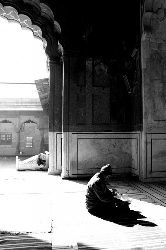 Man reading Quran inside Jama Masjid, Old Delhi