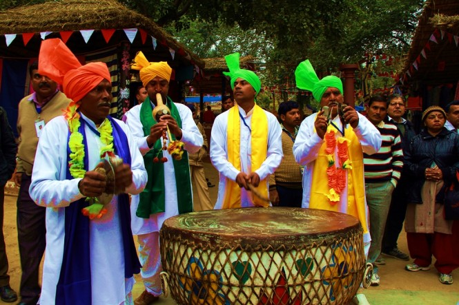 Surajkund Mela - Tribal performer entertaining visitor with local music
