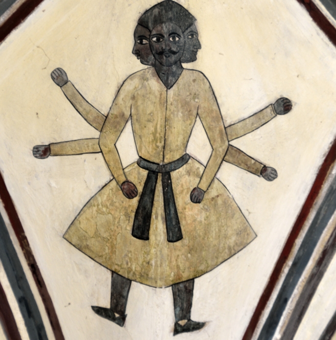 A 3-faced figure on the ceiling of Mughal Gate