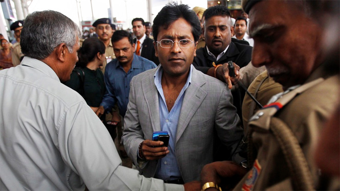 Lalit Modi surrounded by peopl