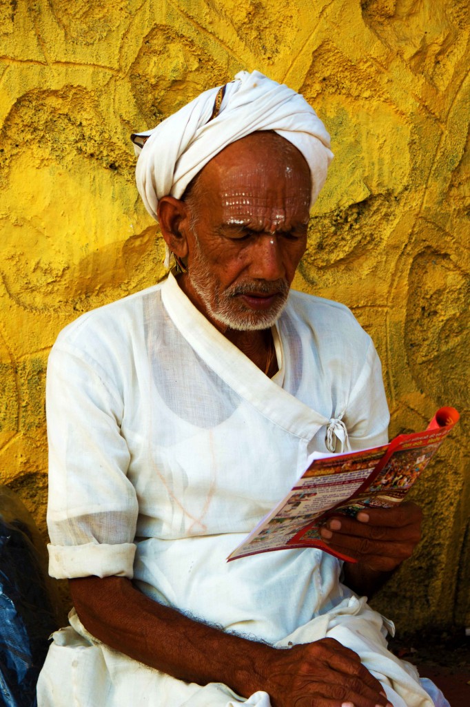 While he is not chanting , he is reading spiritual books.