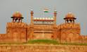 The Red Fort, an iconic symbol of Delhi, features impressive red sandstone walls and intricate Mughal design elements