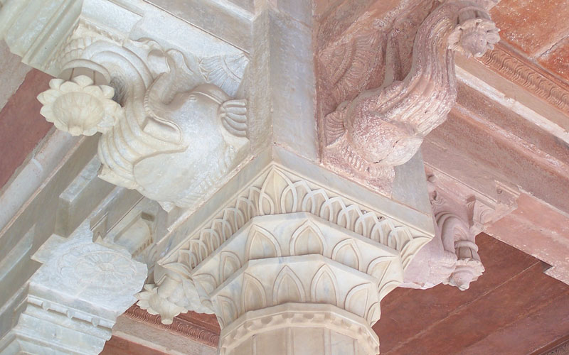Intricately carved marble columns at amber fort